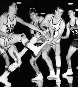 Bill Fuerst &rsquo;69, third from left, and teammates tangle with Monmouth players during the last game of the 1967 season.