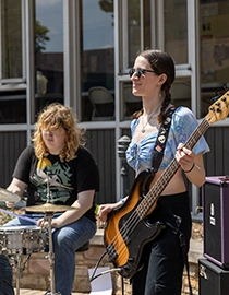 students performing live music during the Earth Month Festival