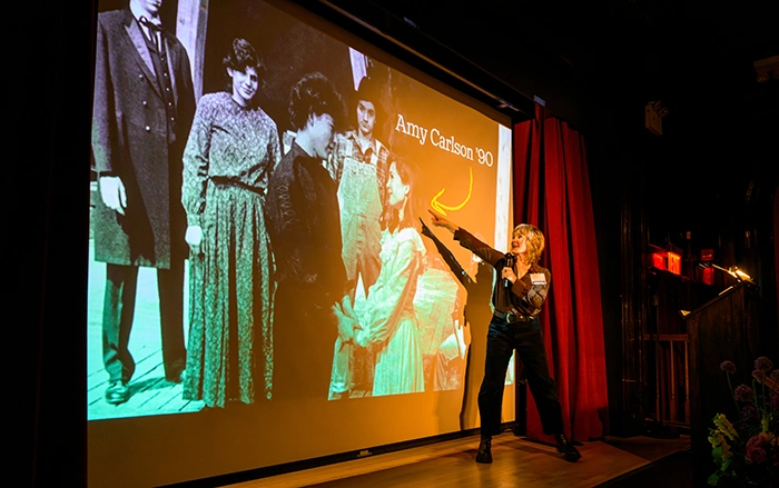 Amy Carlson points to a photo of herself during her time at Knox as a student, on stage during Rep Term