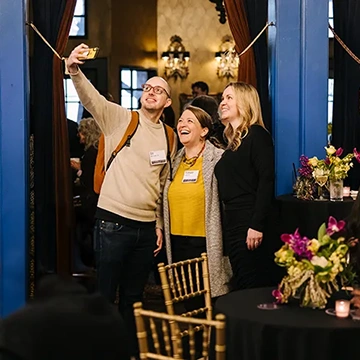 Three Knox alumni and friends take a selfie at the Venture Boldly Seattle event.